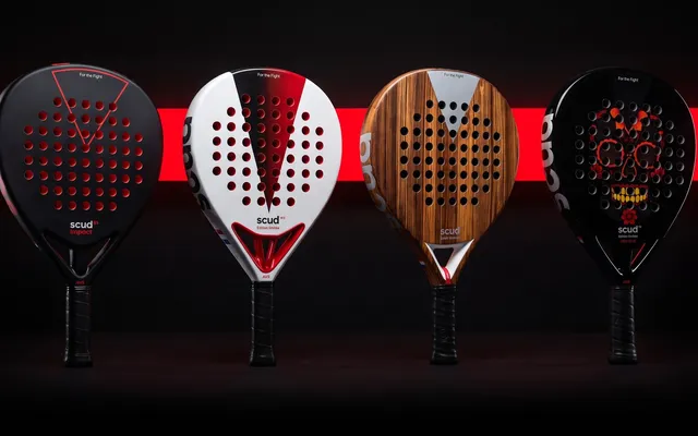 The four SCUD rackets lined up against a black wall crossed by a red line of light: Black Impact B3, White S3, Wood S1 and Mexique M1