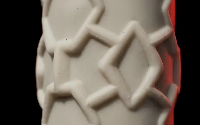 Close-up of the honeycomb silicone handle of a SCUD racket before the grip is fitted: a relief of stars and diamonds
